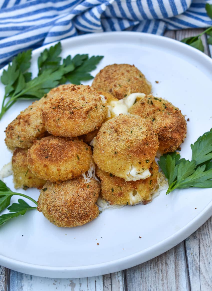 air fried babybell cheese in a pile on a white plate
