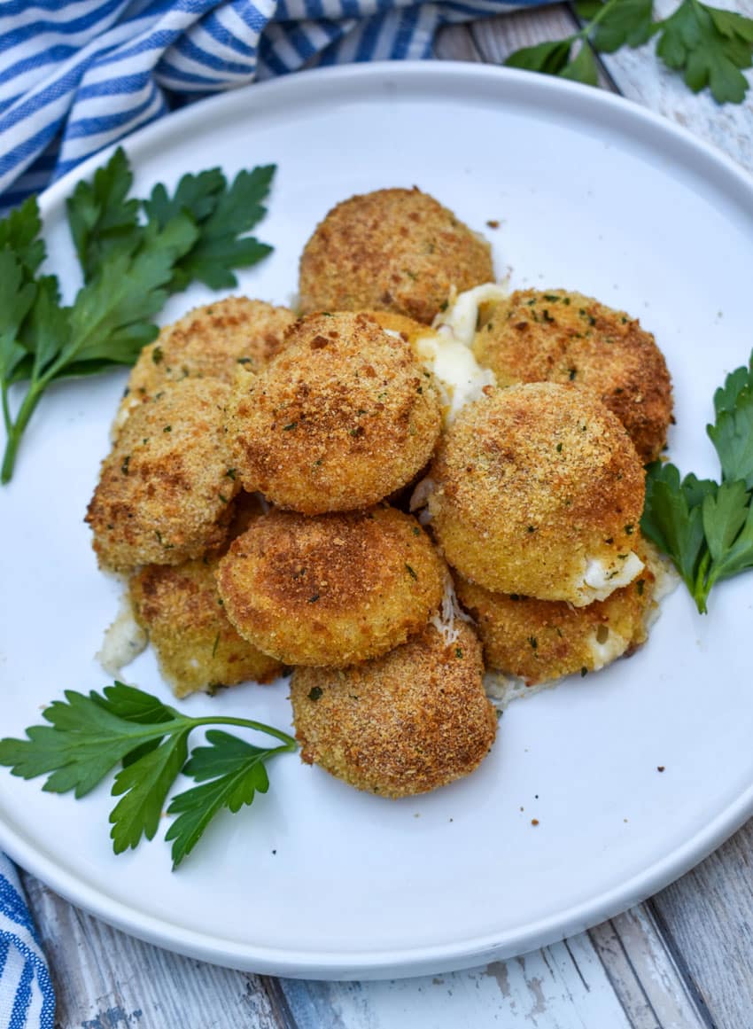 air fried babybell cheese in a pile on a white plate