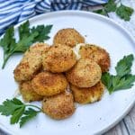 air fried babybell cheese in a pile on a white plate