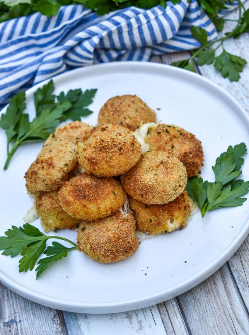 air fried babybell cheese in a pile on a white plate