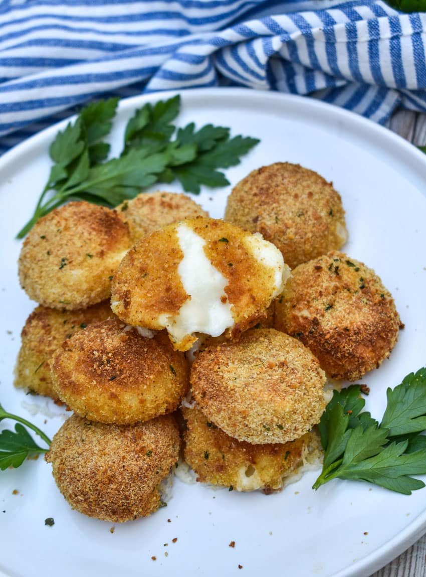 air fried babybell cheese in a pile on a white plate