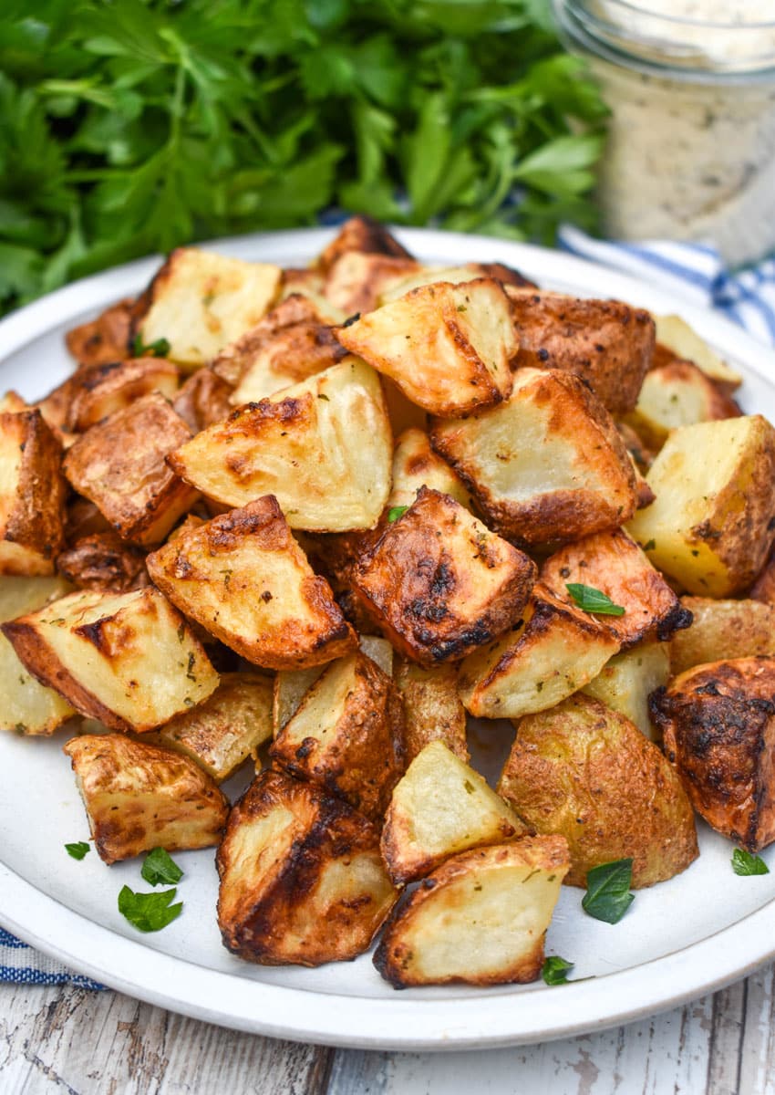air fried crispy ranch potatoes on a white plate