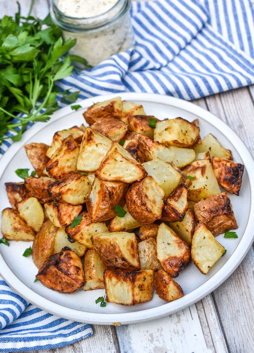 air fried crispy ranch potatoes on a white plate