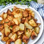 air fried crispy ranch potatoes on a white plate