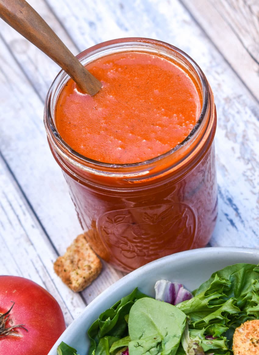 condensed tomato soup salad dressing in a small glass jar