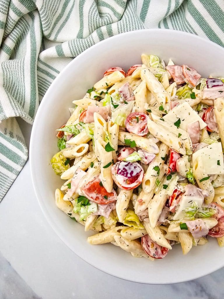 Italian hoagie pasta salad in a white serving bowl