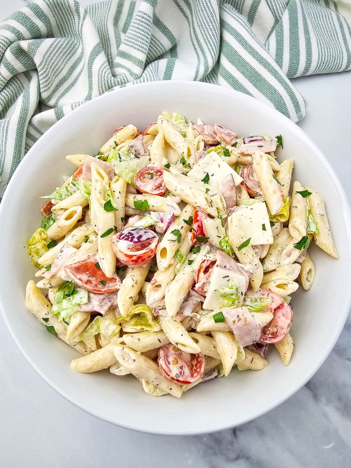 Italian hoagie pasta salad in a white serving bowl
