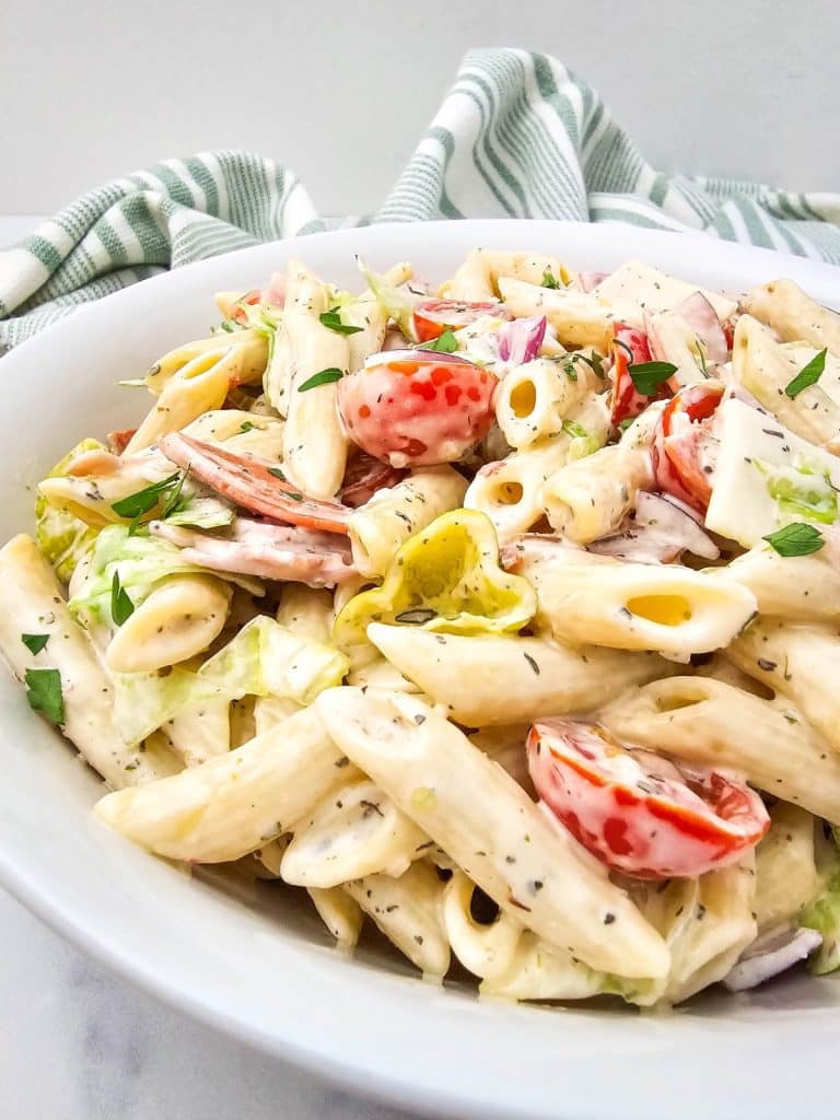 Italian hoagie pasta salad in a white serving bowl