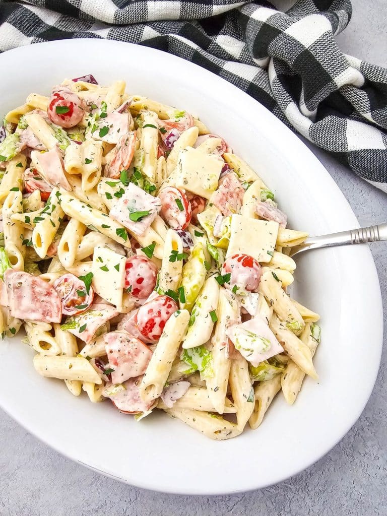 Italian hoagie pasta salad in a white serving bowl
