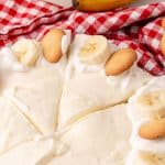 a close up image showing a sliced banana cream pie