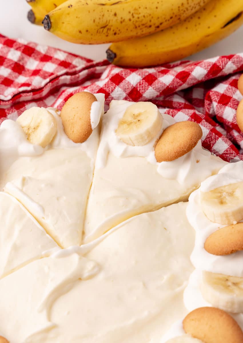 a close up image showing a sliced banana cream pie