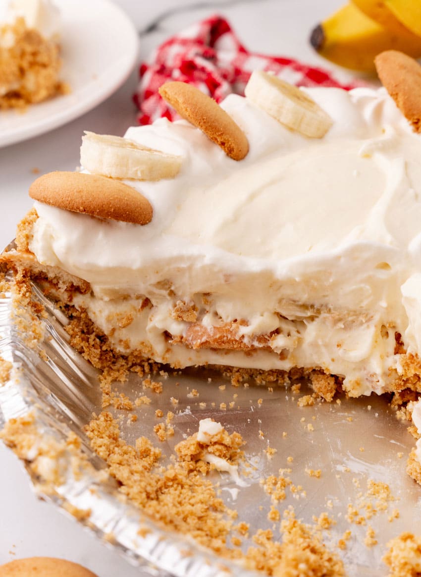 a close up image showing a sliced banana cream pie