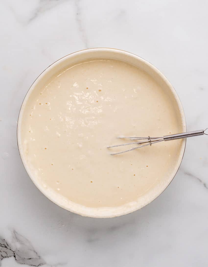 homemade beer batter in a white mixing bowl