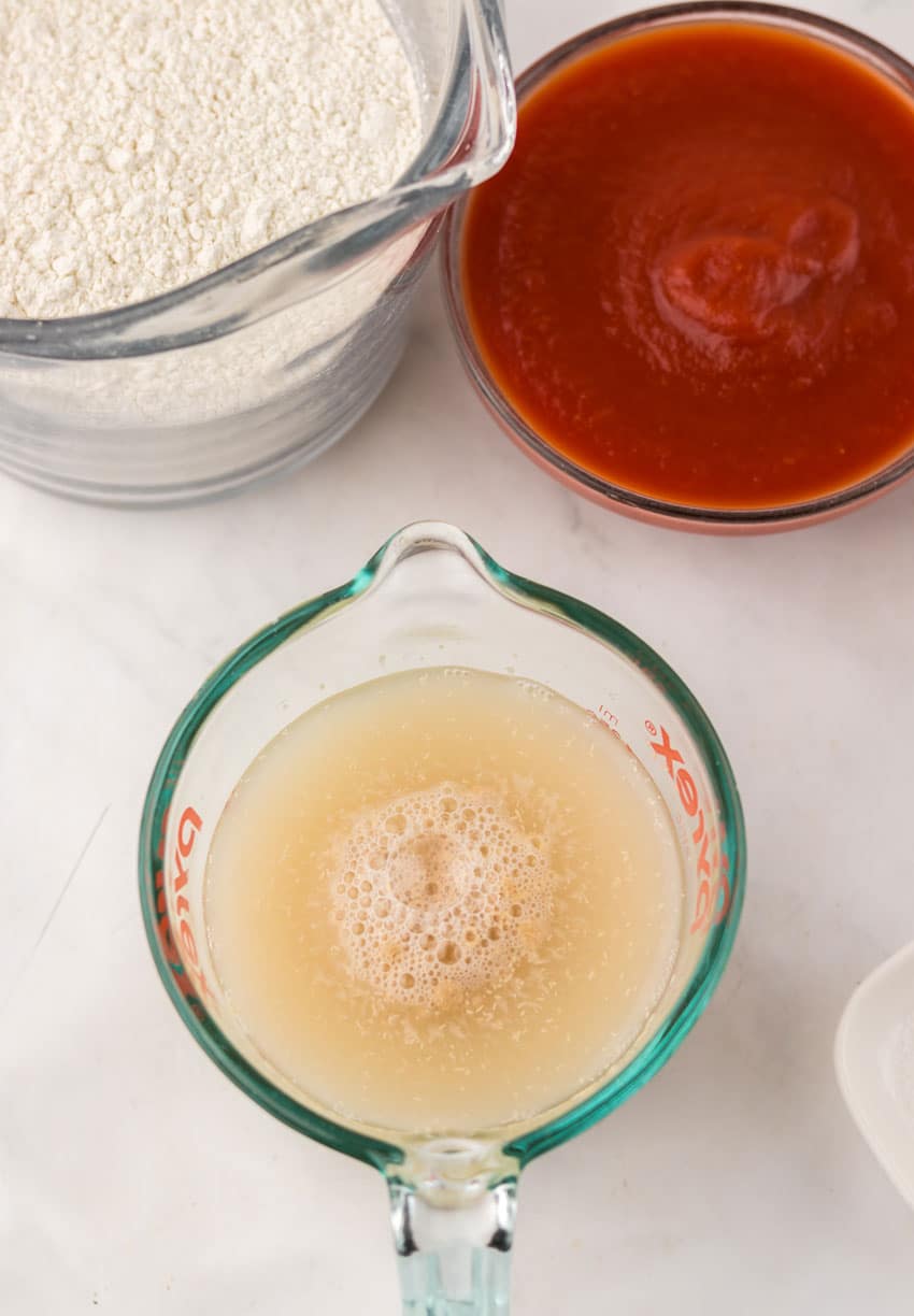 proofing yeast in a small glass measuring glass