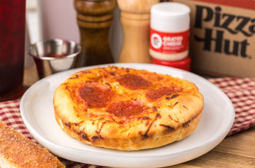 a copycat pizza hut personal pan pizza on a white plate