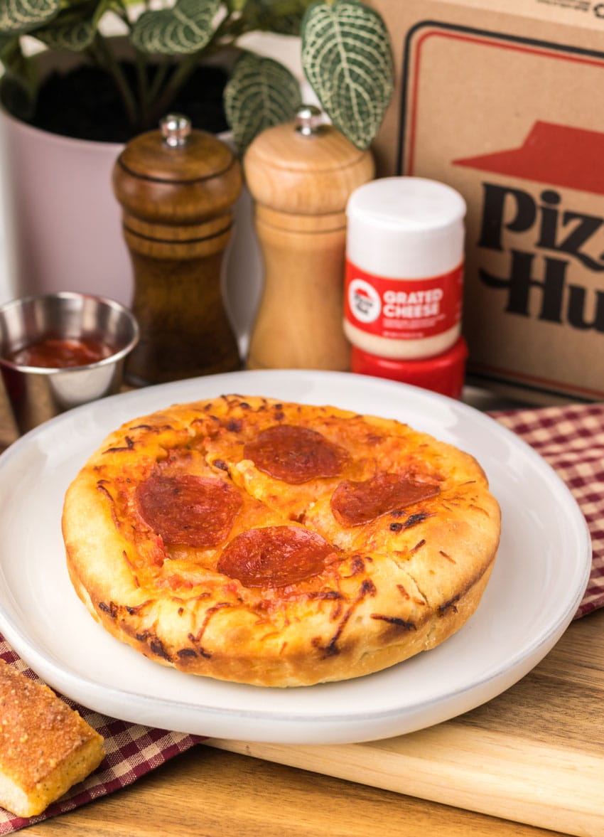 a copycat pizza hut personal pan pizza on a white plate