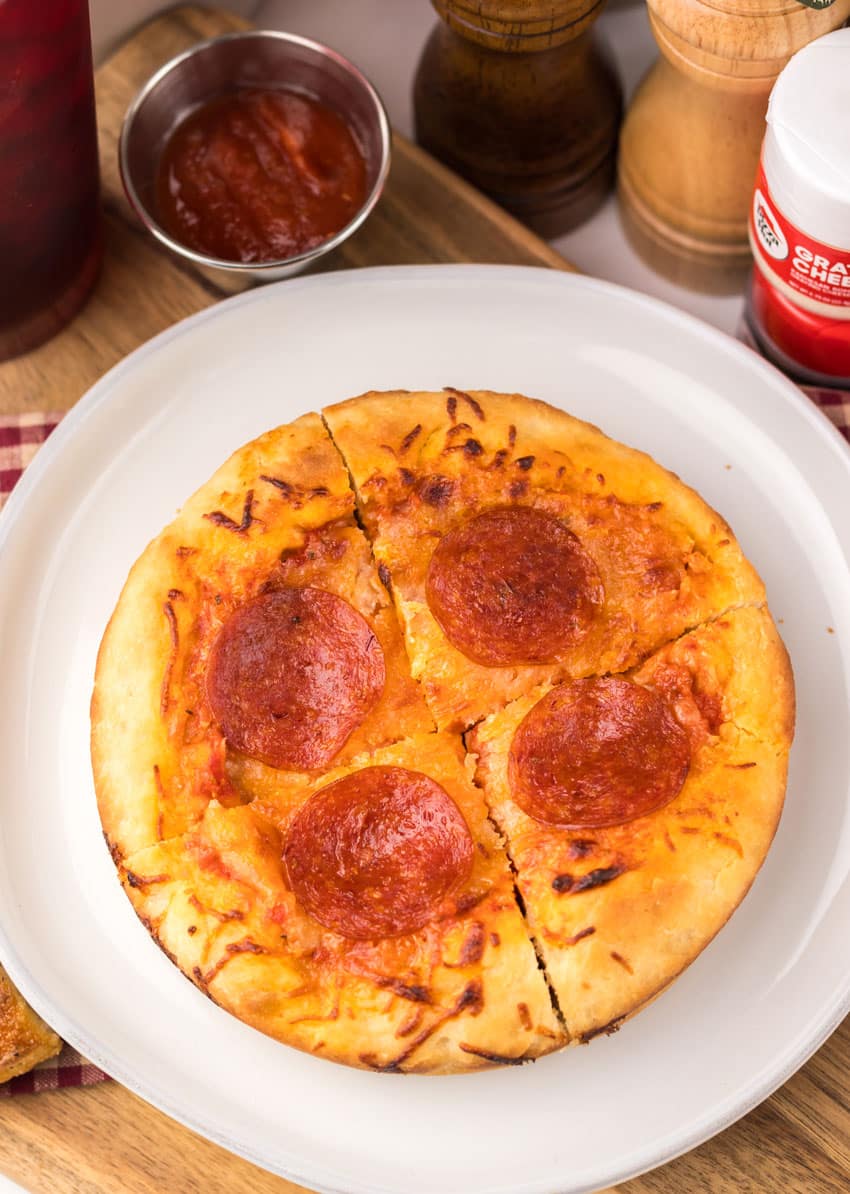 a copycat pizza hut personal pan pizza on a white plate