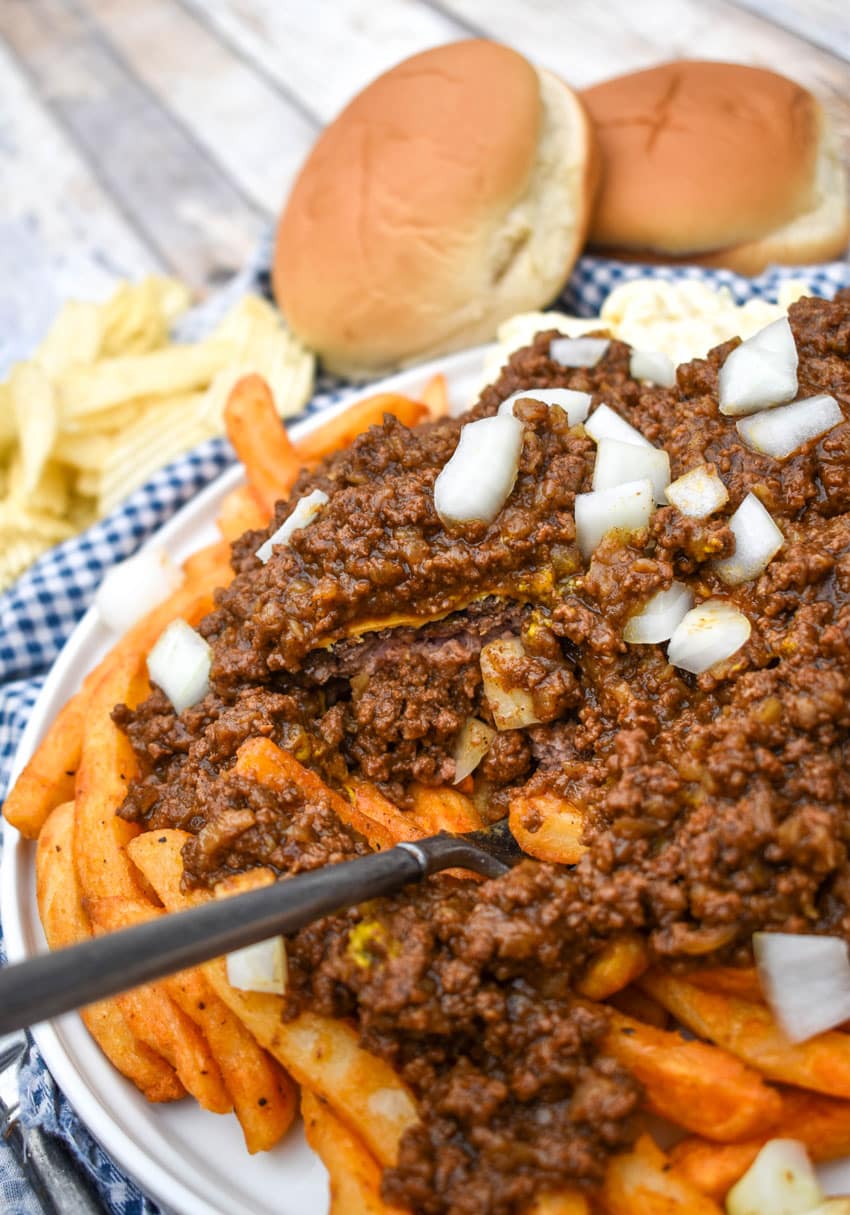 a fork digging into a homemade new york style garbage plate