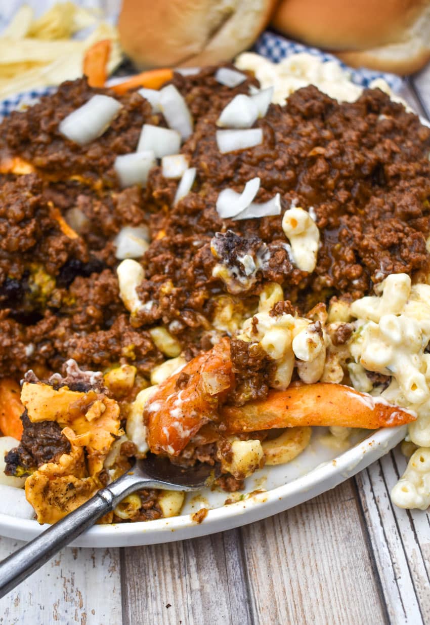 a fork digging into a homemade new york style garbage plate