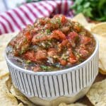 easy salsa fresca in a small white bowl surrounded by tortilla chips