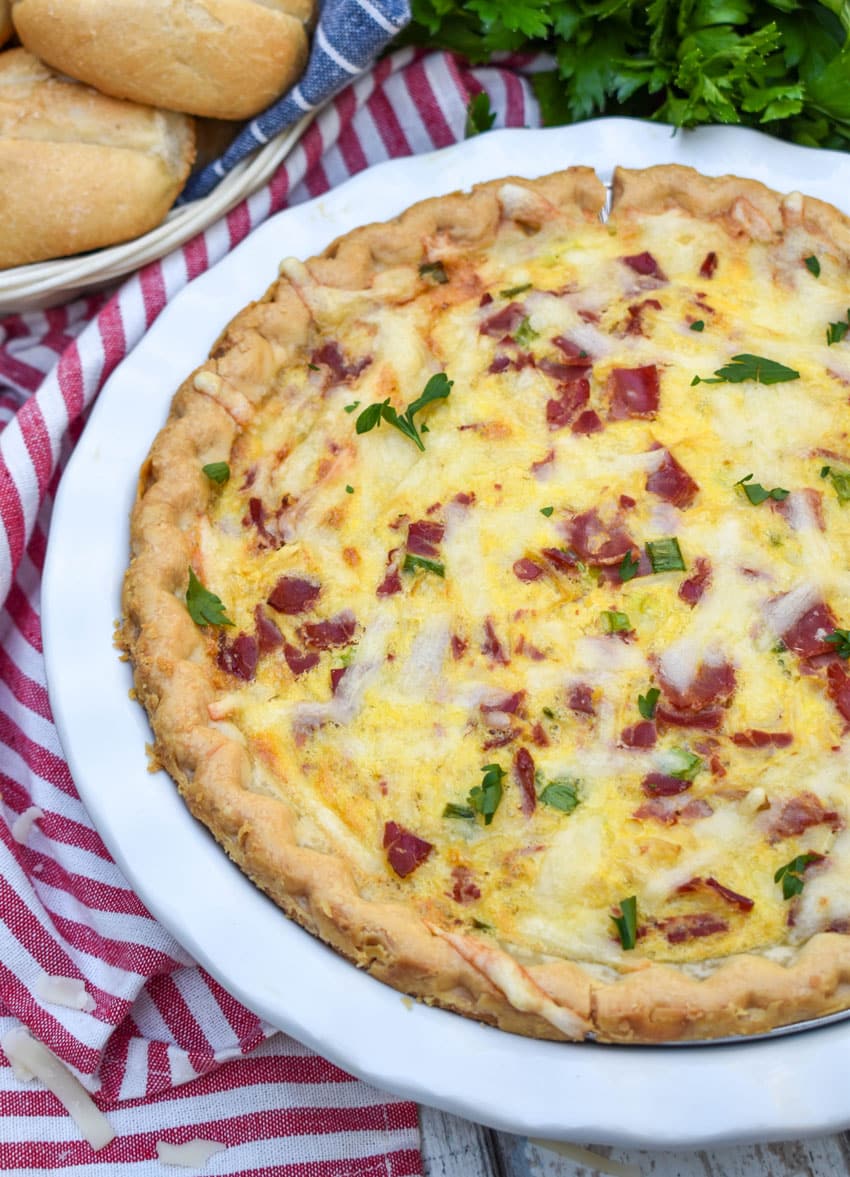 a baked reuben quiche in a white pie plate