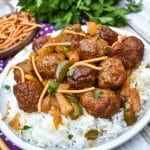 slow cooker sweet and sour meatballs over steamed white rice on a white plate