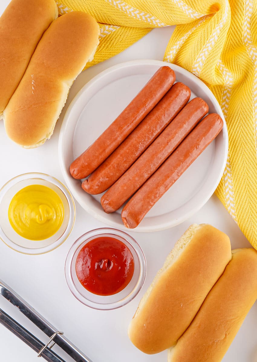 an overhead image showing the measured ingredients needed to make hot dogs in the air fryer