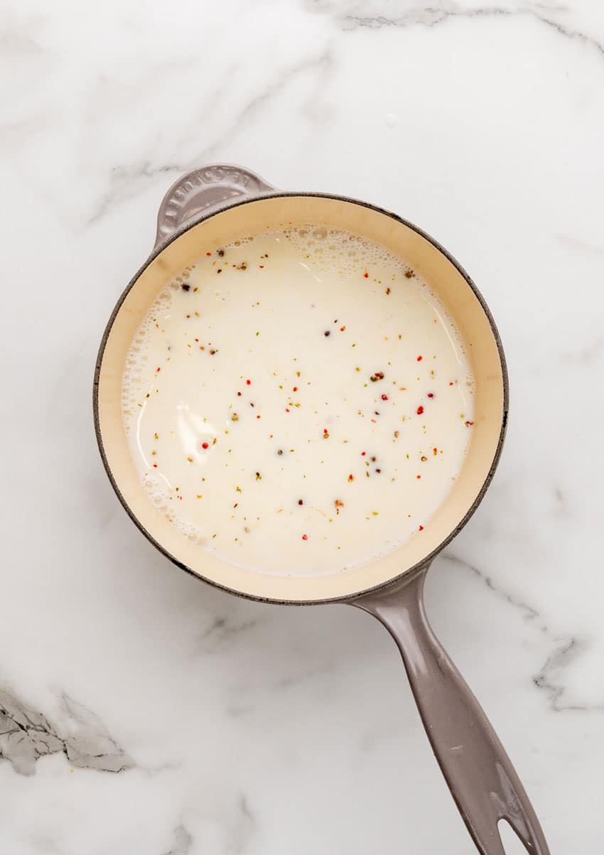seasoned milk mixture in a small gray skillet