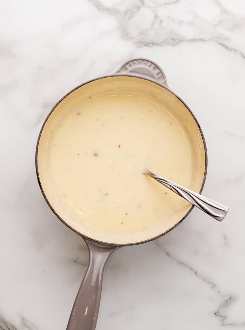 homemade white gravy in a small gray sauce pan