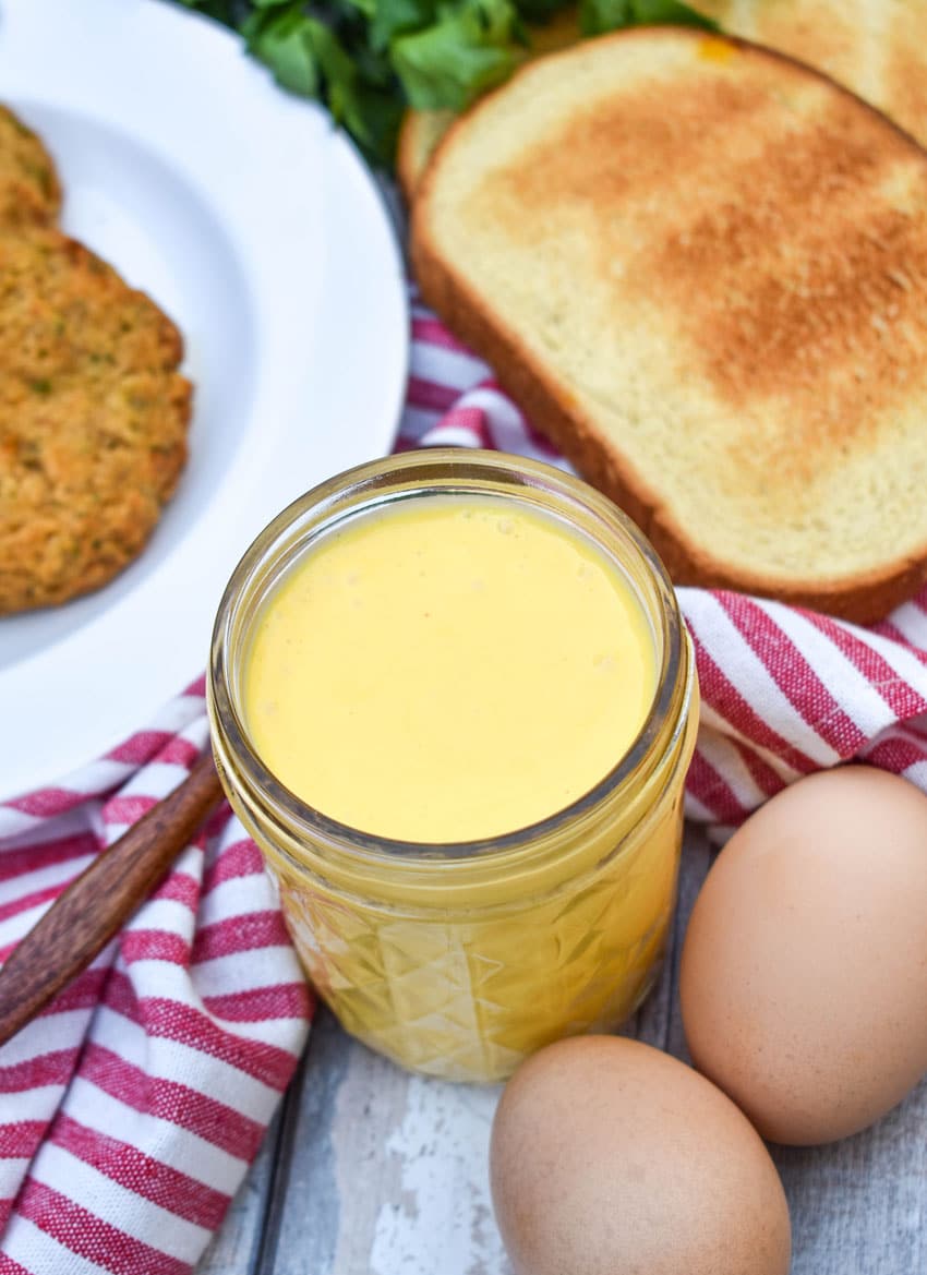 blender hollandaise sauce in a small glass mason jar