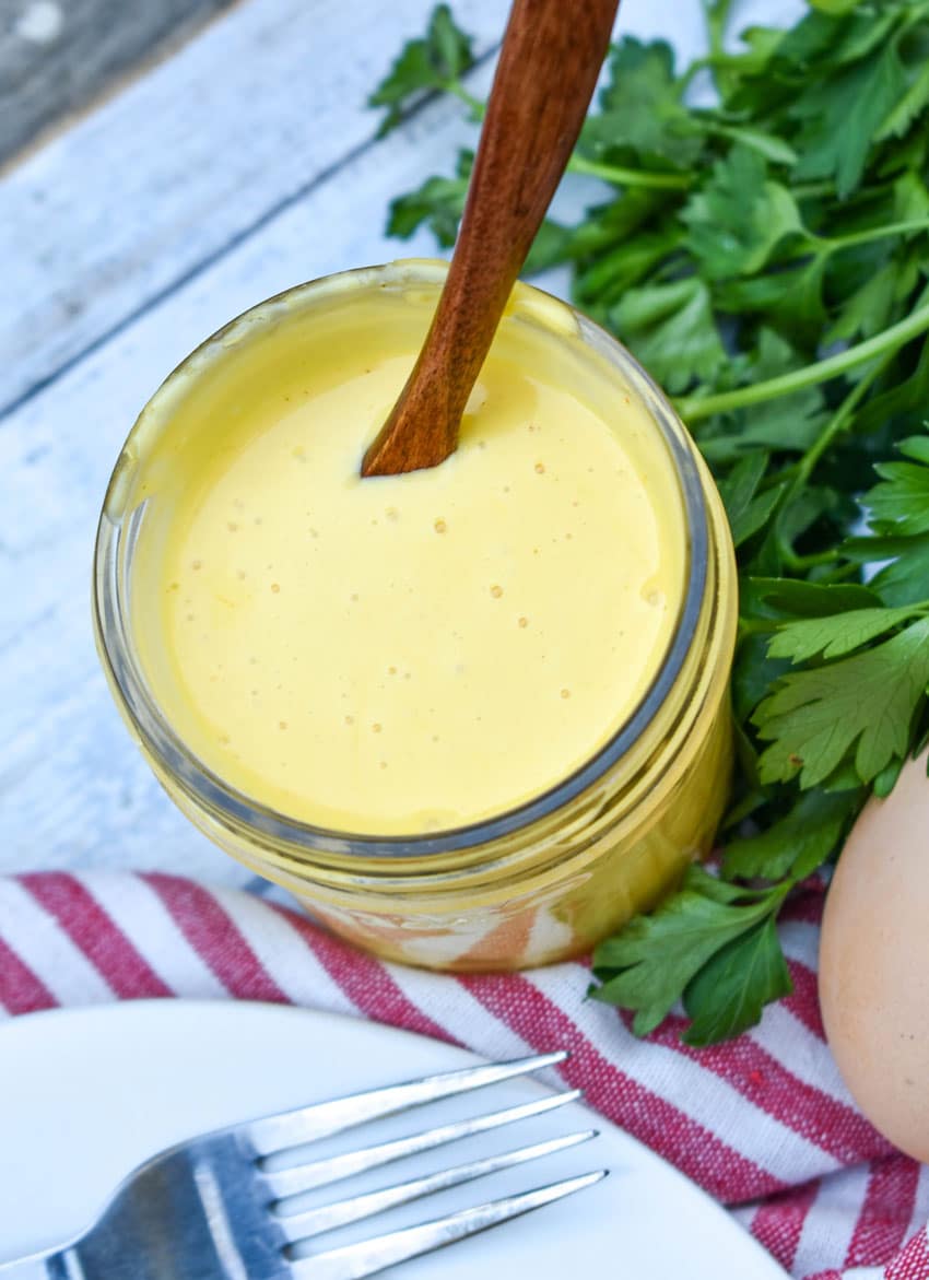 blender hollandaise sauce in a small glass mason jar