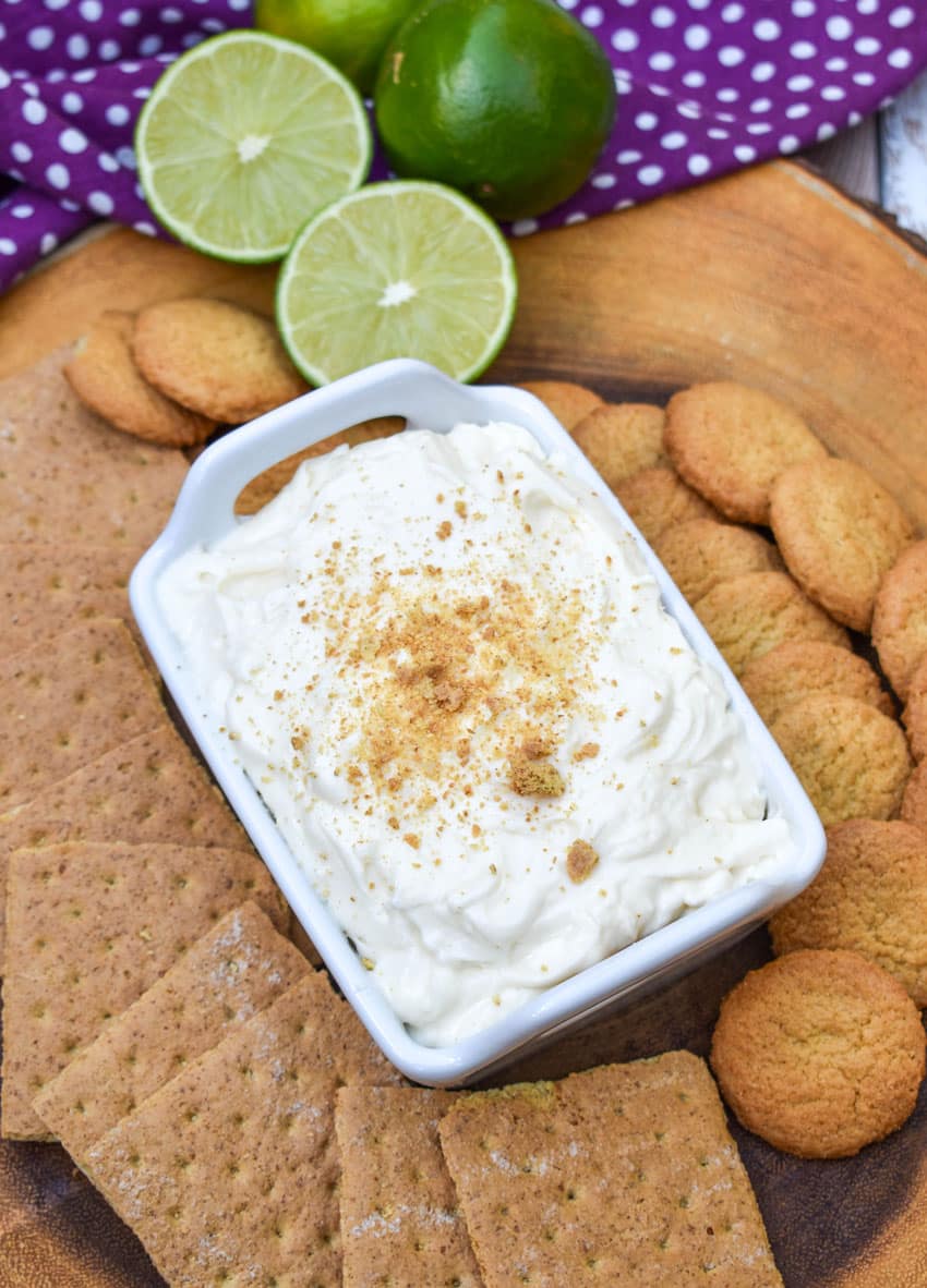 key lime pie dip topped with graham cracker crumbs in a small white serving dish