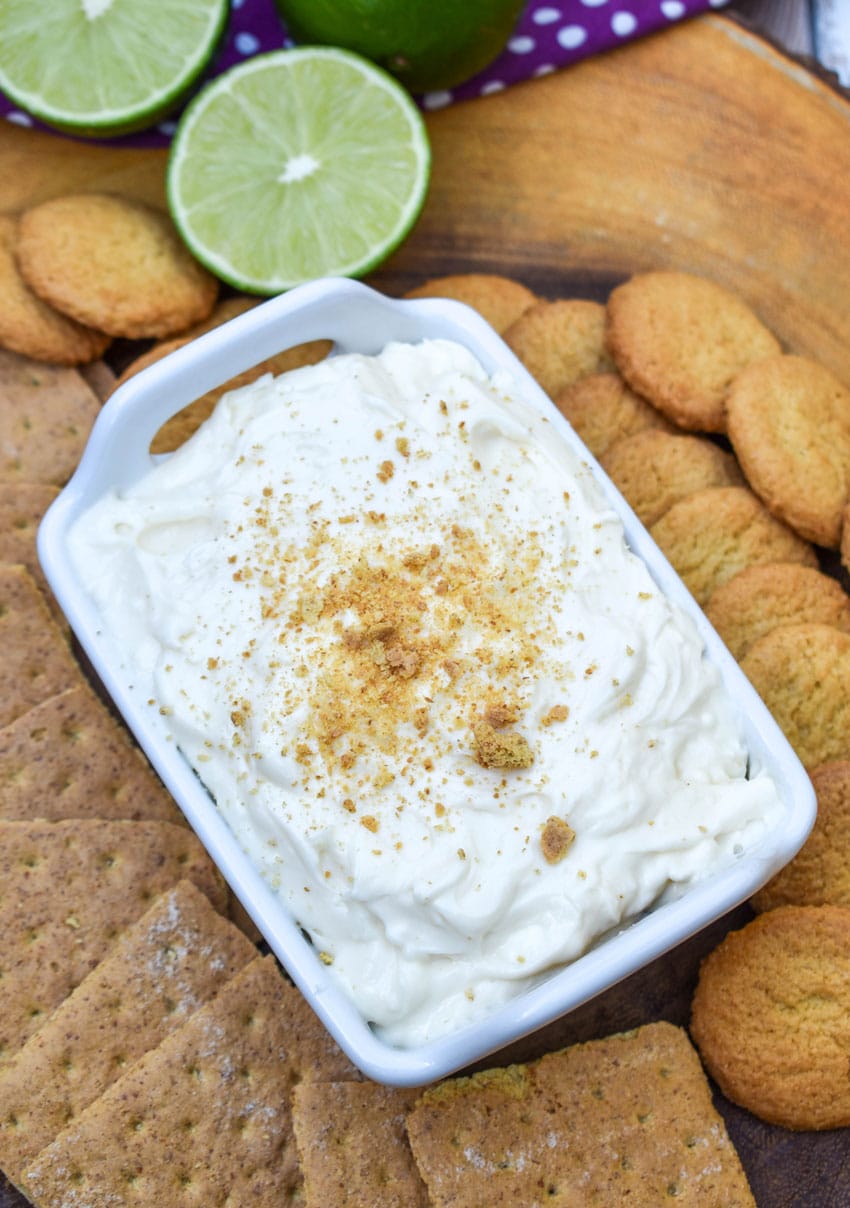 key lime pie dip topped with graham cracker crumbs in a small white serving dish