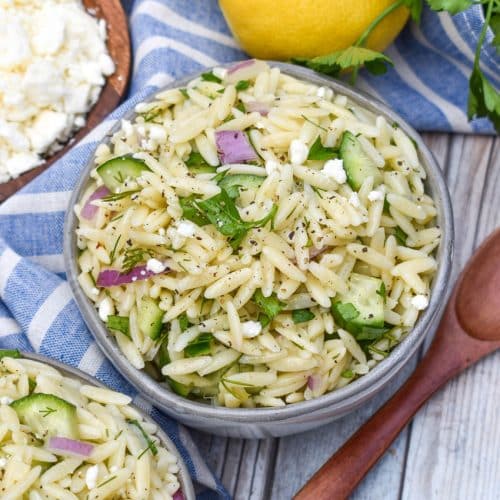 cucumber lemon orzo salad in two small gray bowls