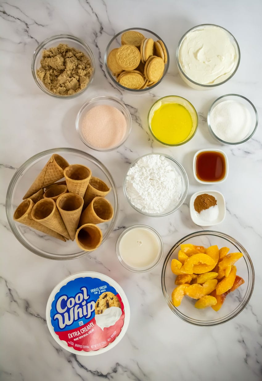 an overhead image showing the measured ingredients needed to make a batch of peach cobbler cheesecake cones