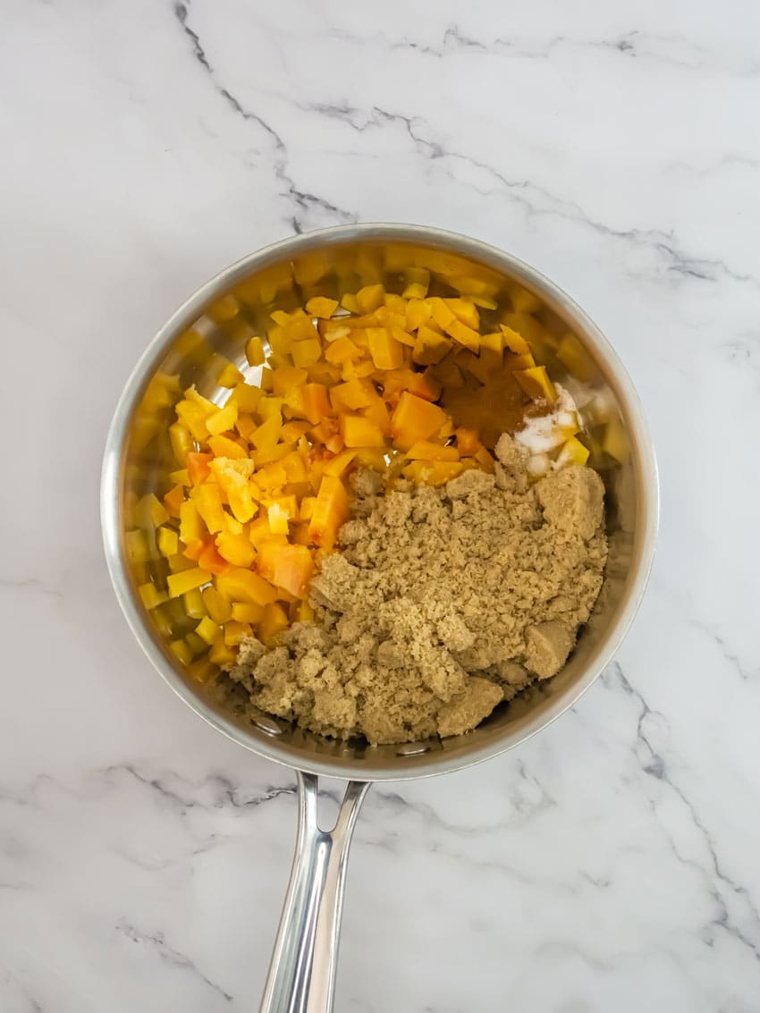 homemade peach pie filling ingredients in a small metal pot