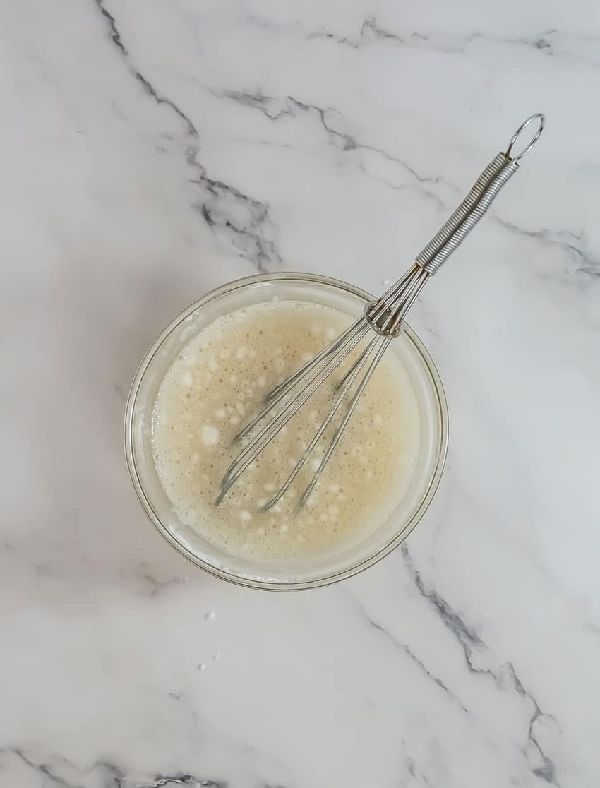 a homemade glaze in a small glass bowl