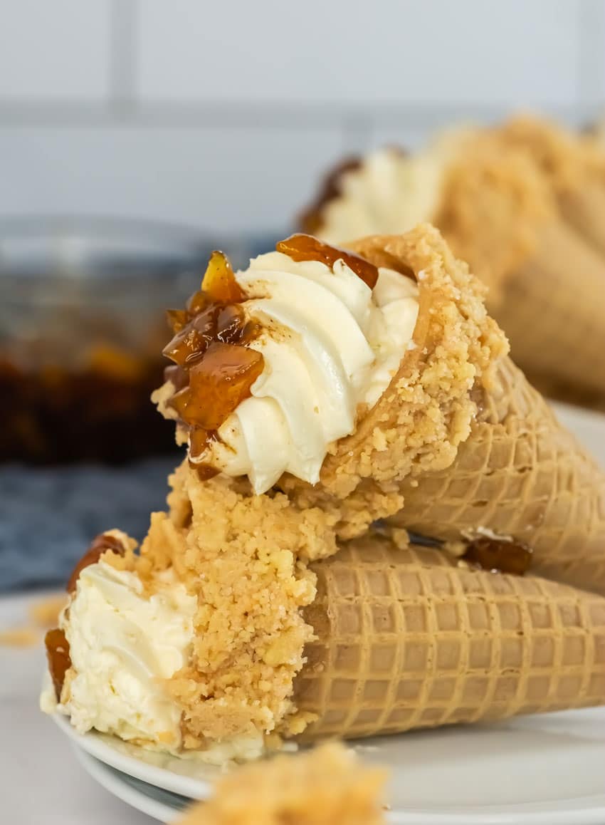 Peach Cobbler Cheesecake Cones peach cobbler cheese cake cones on a white serving plate