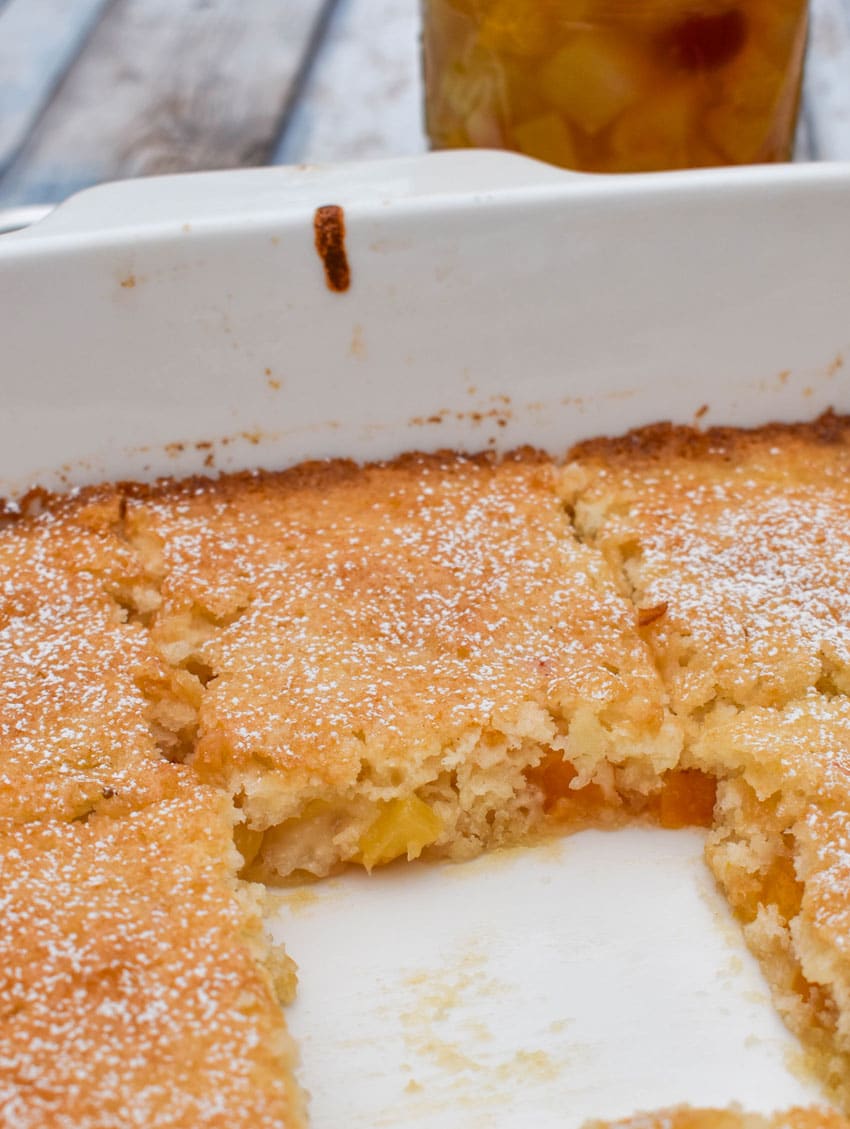 a vintage fruit cocktail cake in a square white baking dish
