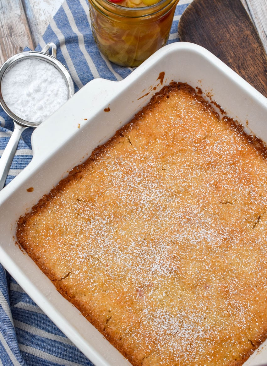 a vintage fruit cocktail cake in a square white baking dish