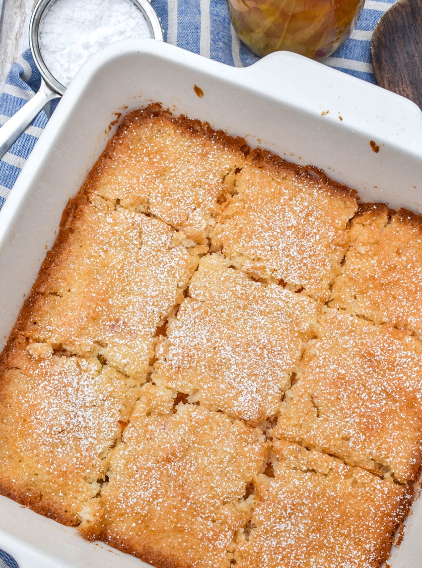 a vintage fruit cocktail cake in a square white baking dish