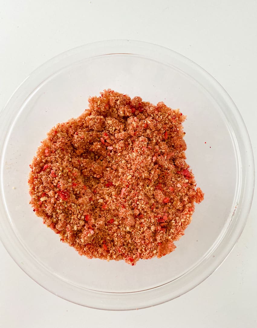 homemade strawberry crunch topping in a small glass mixing bowl