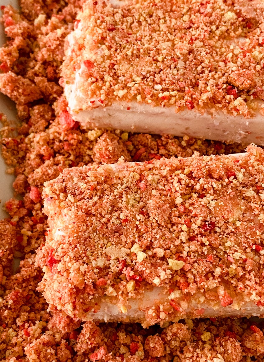 a close up of homemade strawberry crunch ice cream bars