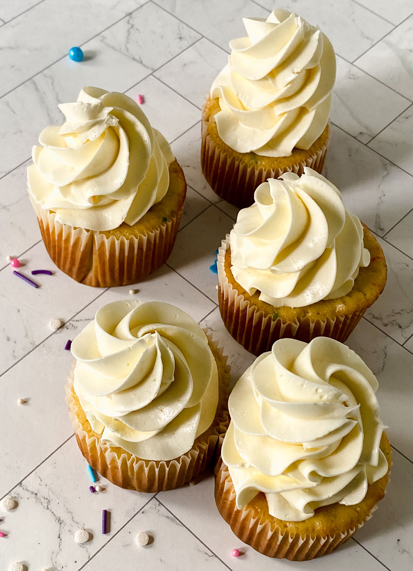 swirls of better canned frosting shown on homemade cupcakes