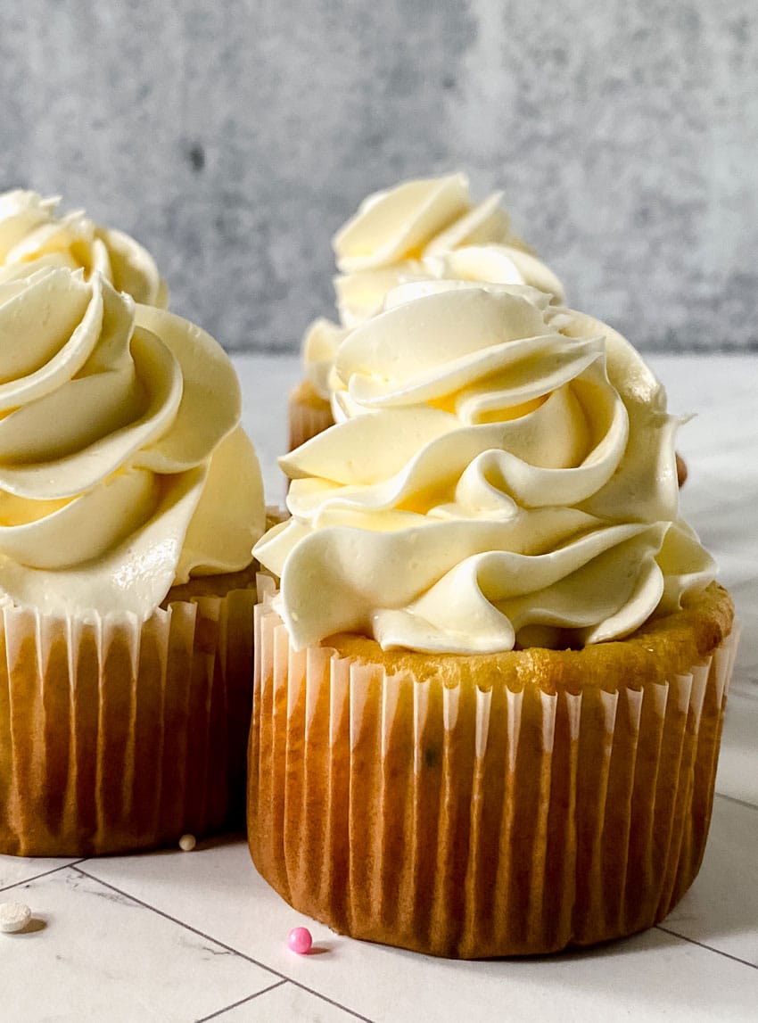 swirls of better canned frosting shown on homemade cupcakes