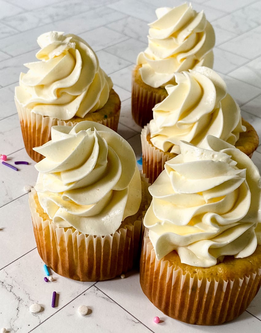 swirls of better canned frosting shown on homemade cupcakes