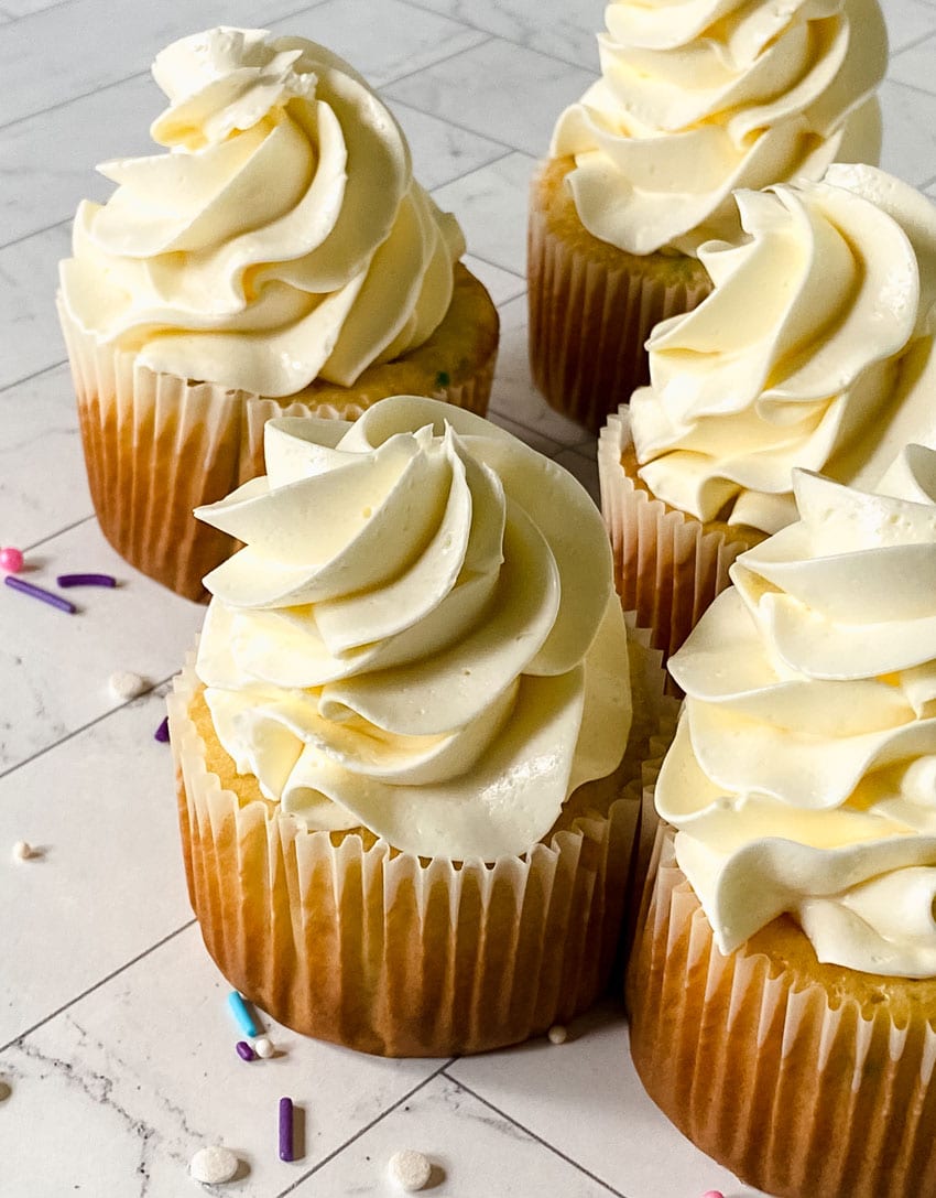 swirls of better canned frosting shown on homemade cupcakes
