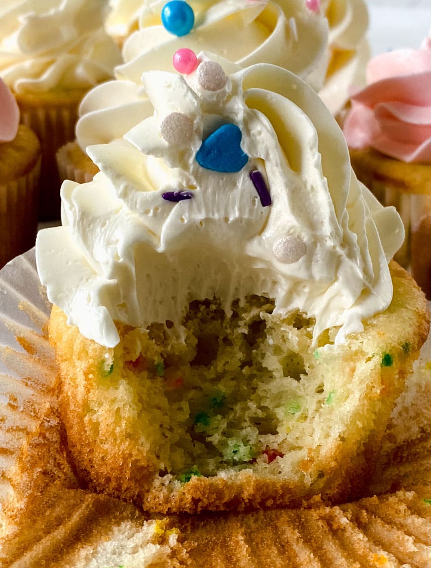 swirls of better canned frosting shown on homemade cupcakes