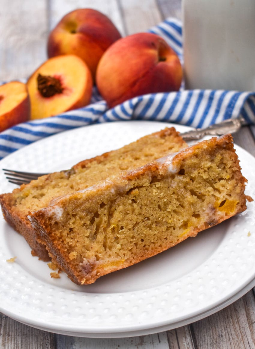slices of glazed peach bread on a small white plate