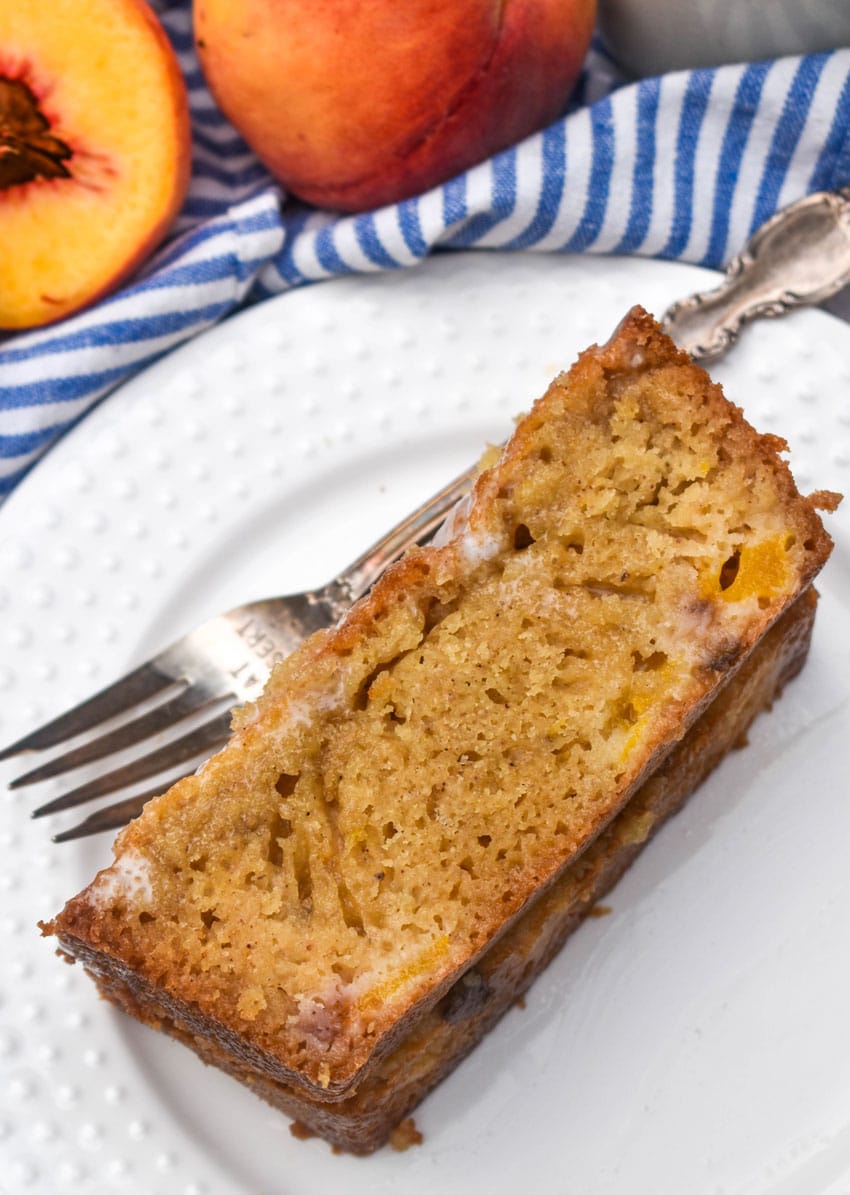 slices of glazed peach bread on a small white plate